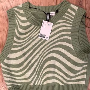 H&M “indie” green zebra print sweater vest. Size small.